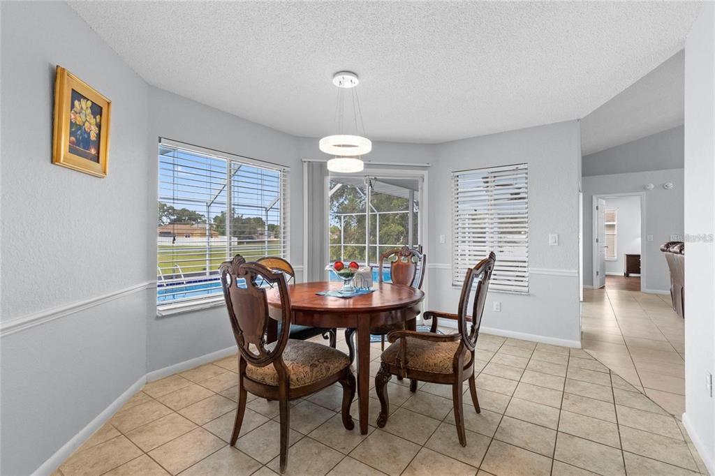 10446 Baylor Drive Spring Hill, FL 34608 - Photo 14 of 32 a dining room with furniture and window