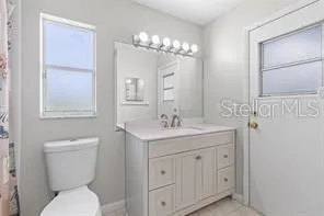 a bedroom with a bed and a table