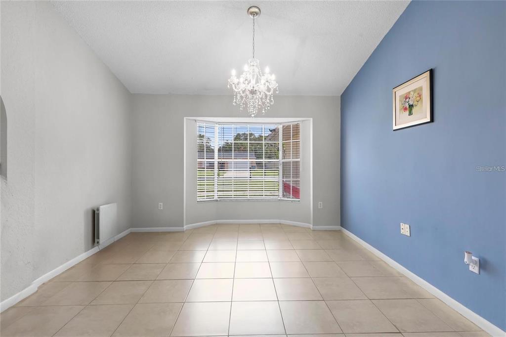 10446 Baylor Drive Spring Hill, FL 34608 - Photo 7 of 32 a view of an empty room with a window