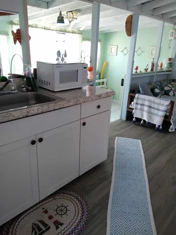 a bedroom with bed and window