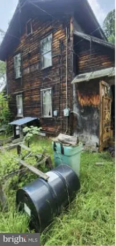 a backyard of a house with dishwasher and outdoor seating