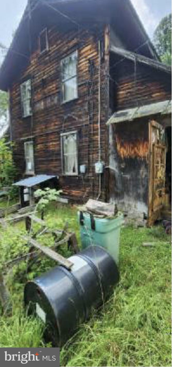 83 Ankney Lane Westover, PA 16692 - Photo 4 of 15 a backyard of a house with dishwasher and outdoor seating