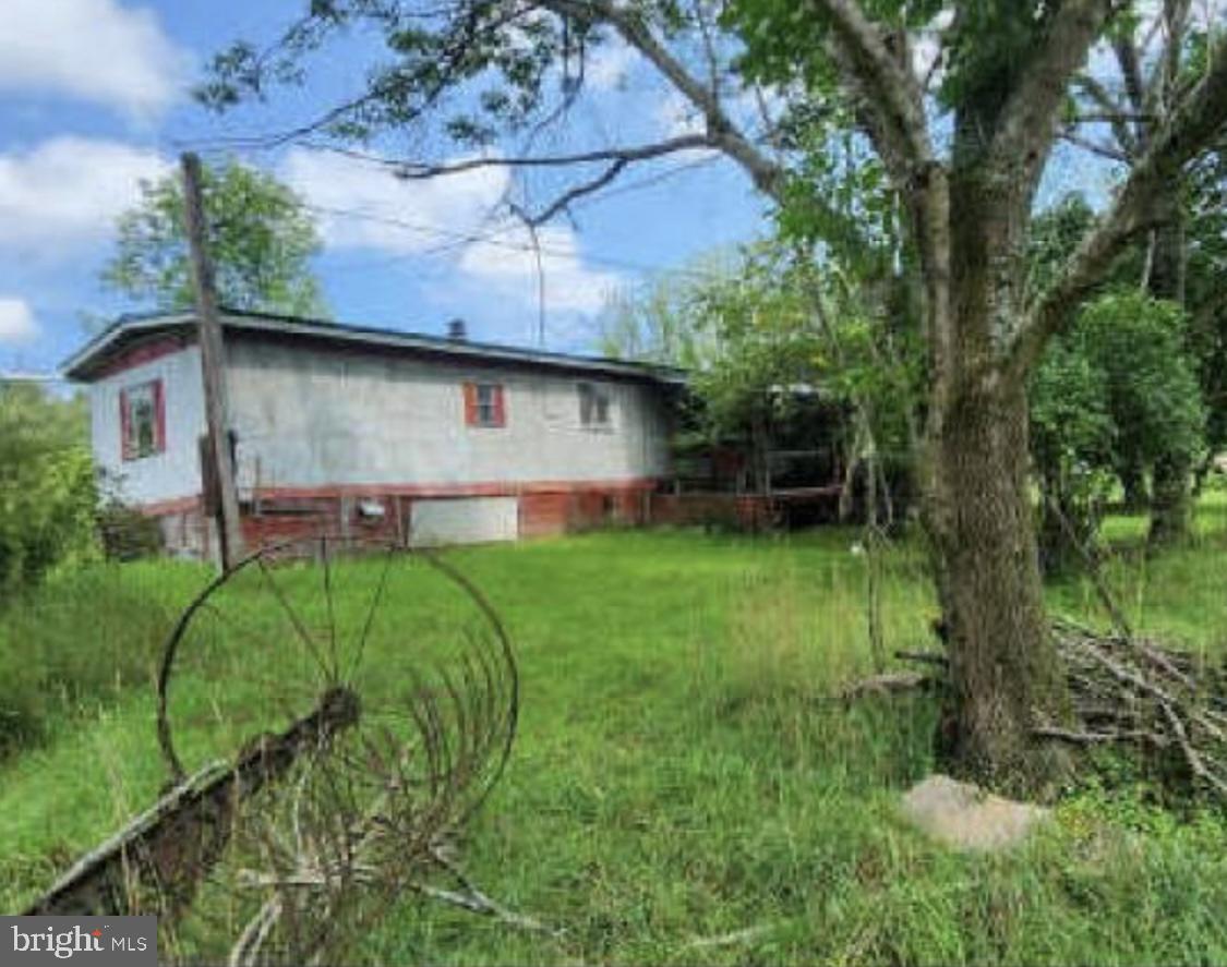 83 Ankney Lane Westover, PA 16692 - Photo 6 of 15 a backyard of a house with lots of green space
