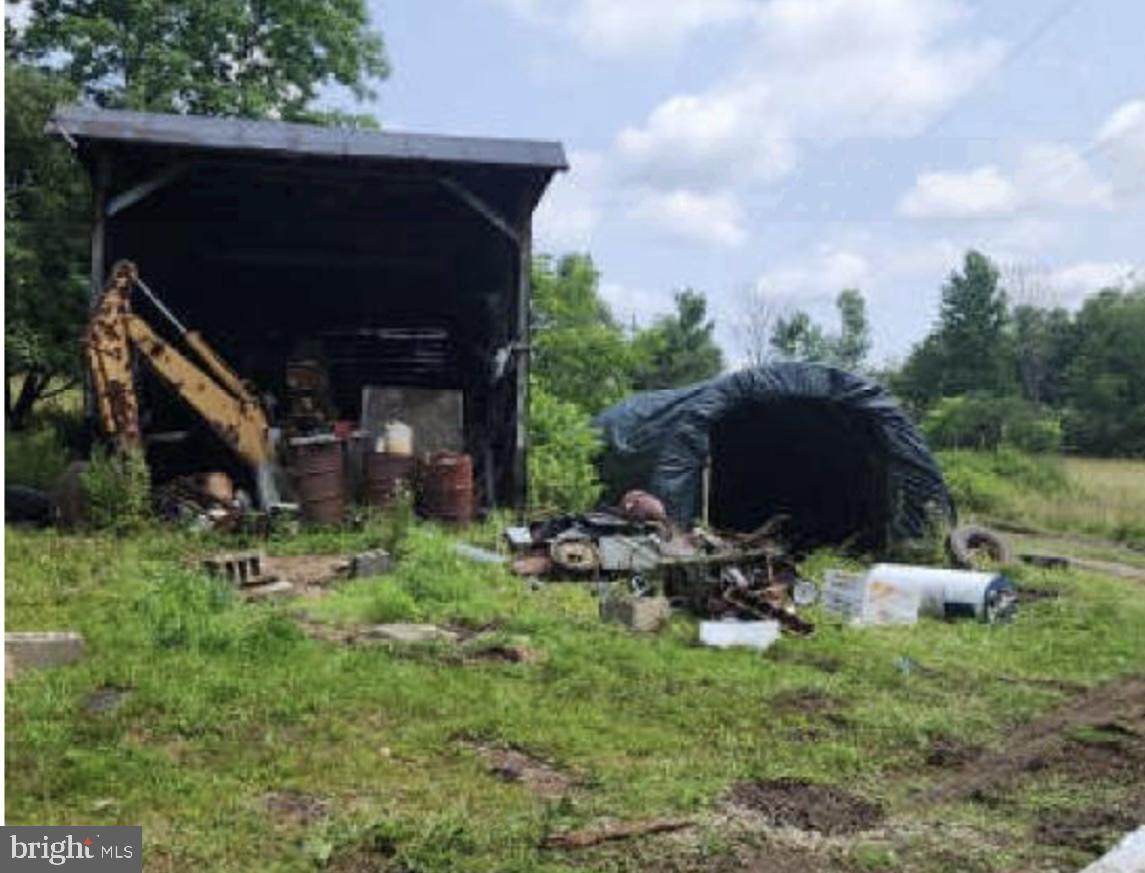83 Ankney Lane Westover, PA 16692 - Photo 9 of 15 a backyard of a house with table and chairs