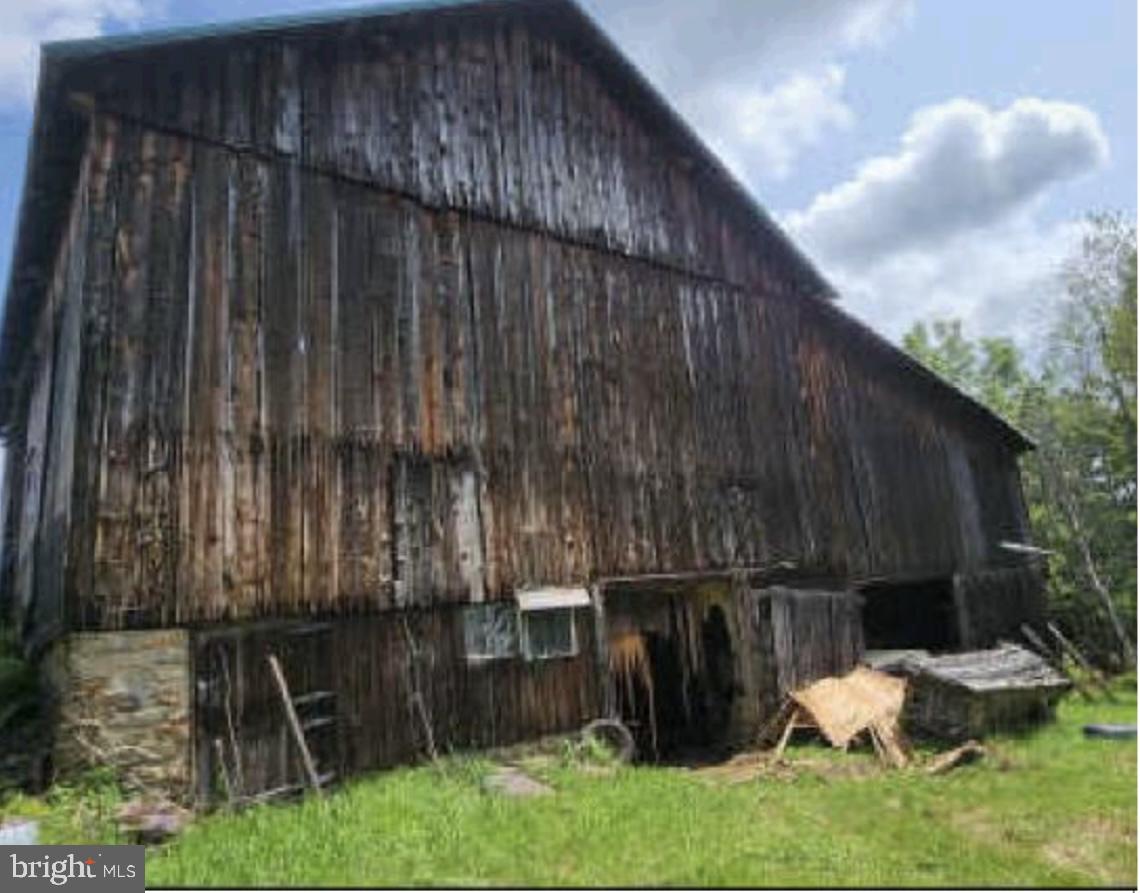 83 Ankney Lane Westover, PA 16692 - Photo 10 of 15 a backyard of a house with chairs and wooden fence