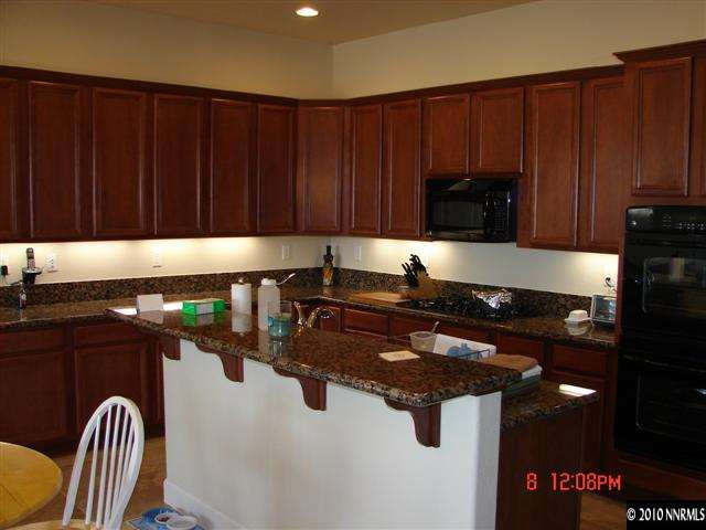 2608 Mule Circle Reno, NV 89521 - Photo 5 of 9 a kitchen with a sink and cabinets