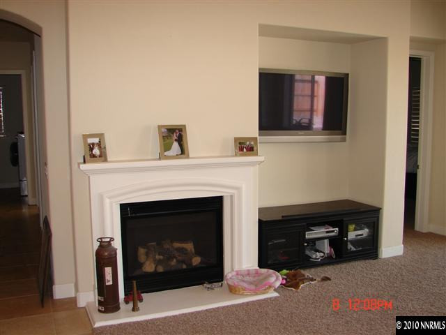 2608 Mule Circle Reno, NV 89521 - Photo 6 of 9 a living room with furniture and a fireplace