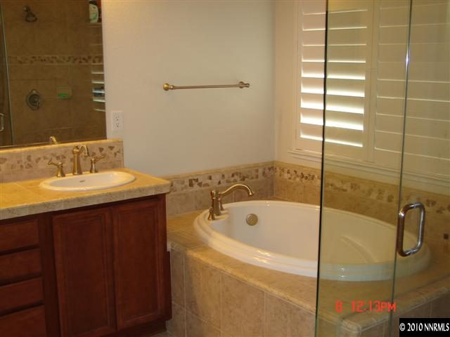 2608 Mule Circle Reno, NV 89521 - Photo 8 of 9 a bathroom with a bathtub and a sink