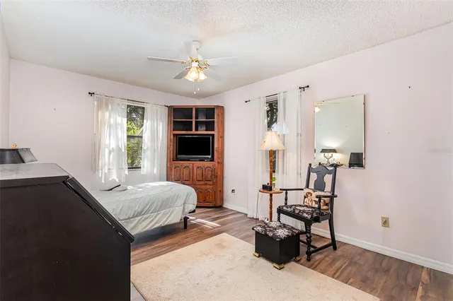 a bedroom with furniture and a window