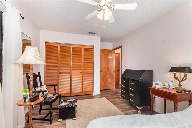 a bedroom with furniture and a window
