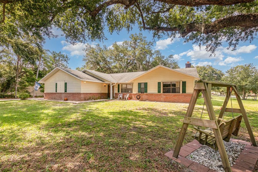 6476 Eve Street St. Cloud, FL 34771 - Photo 2 of 25 a house view with a garden space
