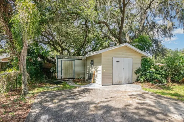 a front view of house with yard and trees