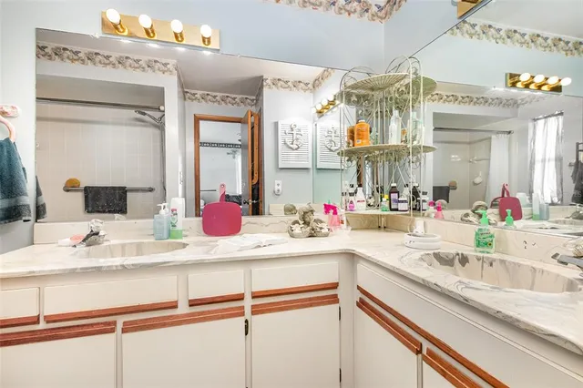 a bathroom with a sink and a mirror
