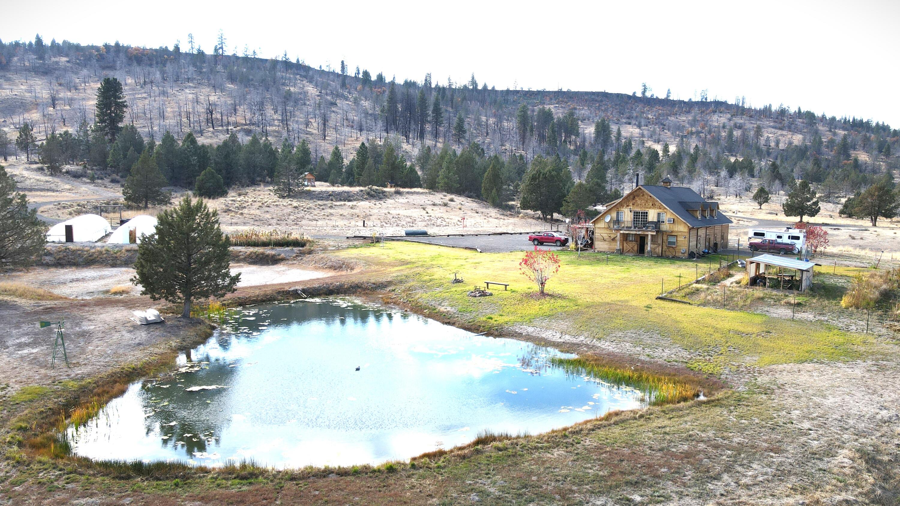 2415 Co Road Canby, CA 96015 - Photo 2 of 74 a view of a swimming pool with a yard and mountain view
