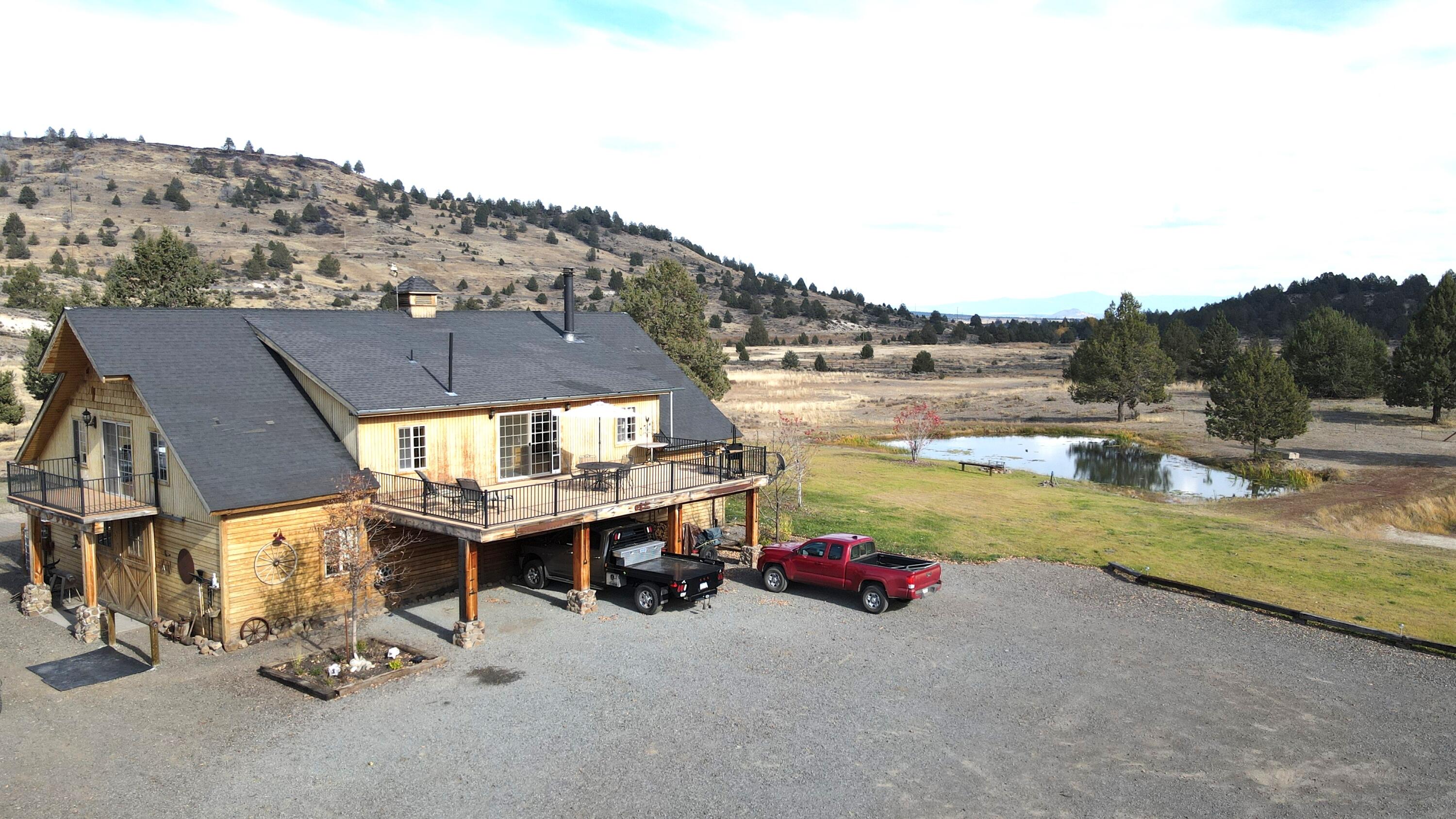 2415 Co Road Canby, CA 96015 - Photo 5 of 74 a view of a lake with a table and chairs