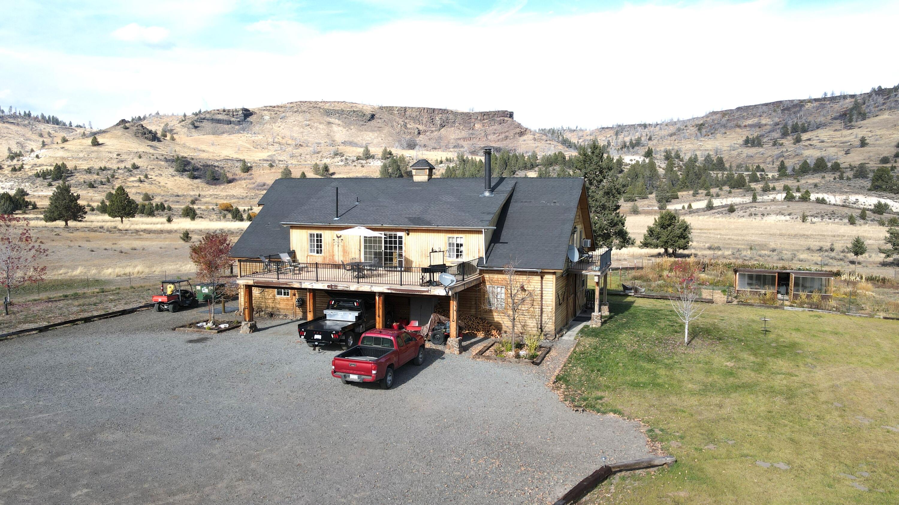 2415 Co Road Canby, CA 96015 - Photo 6 of 74 an aerial view of a house with a garden and mountain view