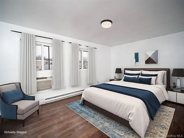 a spacious bedroom with a bed and couch