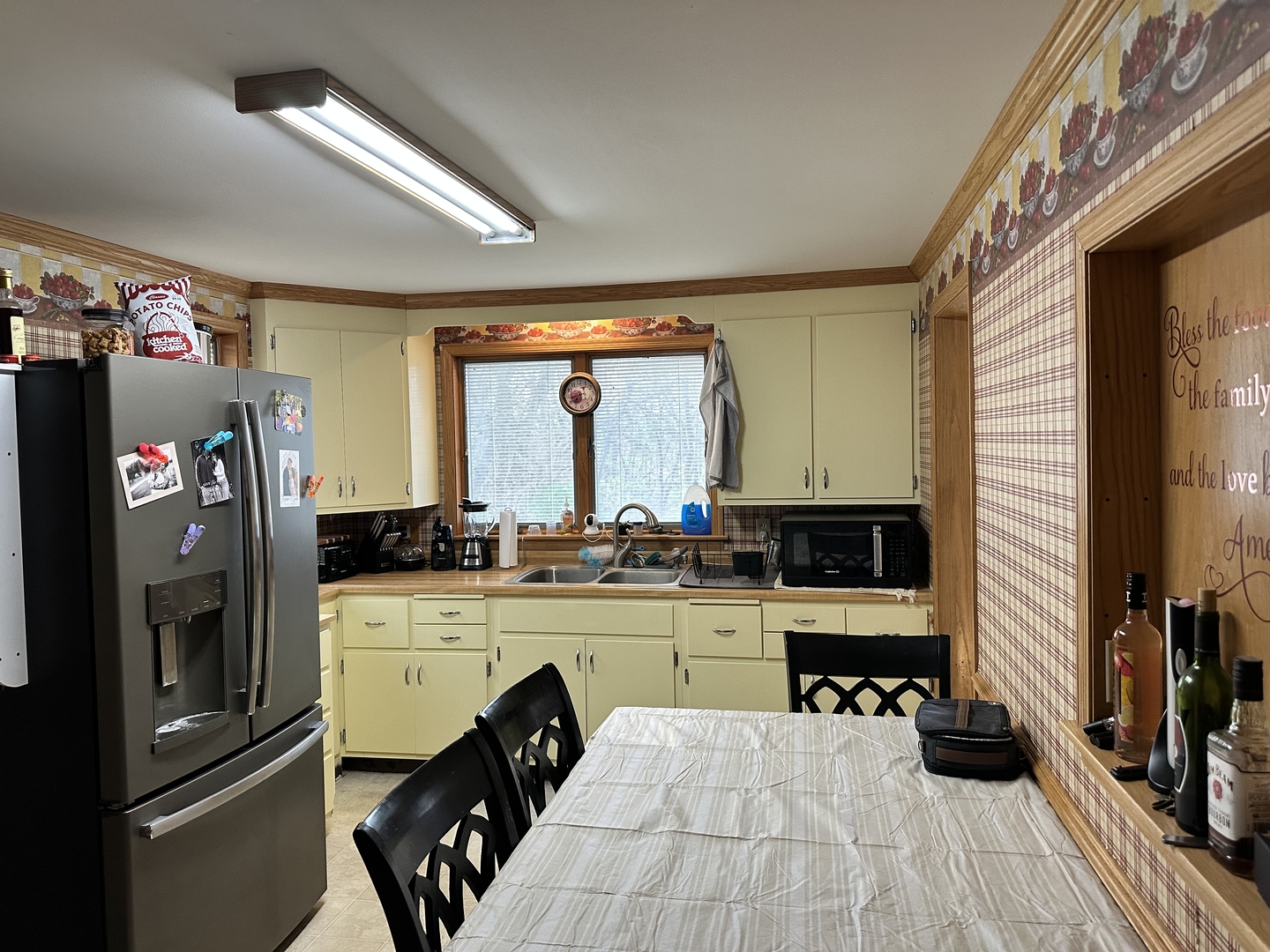 2 Park Road Oglesby, IL 61348 - Photo 3 of 12 a kitchen with a sink a refrigerator and cabinets