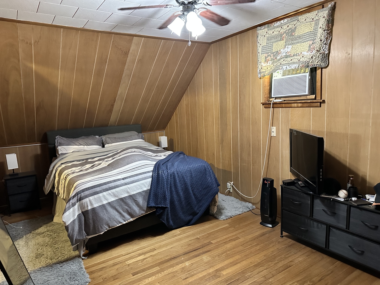 2 Park Road Oglesby, IL 61348 - Photo 7 of 12 a bedroom with a bed and a flat screen tv