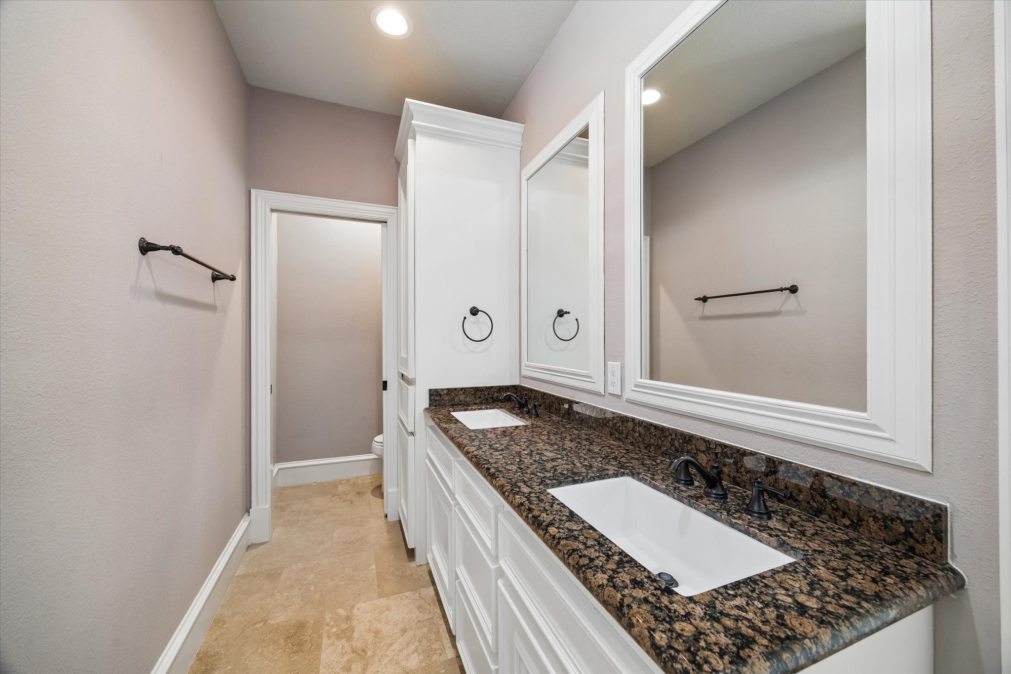 5334 Inker Street Houston, TX 77007 - Photo 23 of 39 Second floor full bathroom featuring dual sinks, granite countertops, and a private, separate water closet for enhanced functionality and simultaneous use.