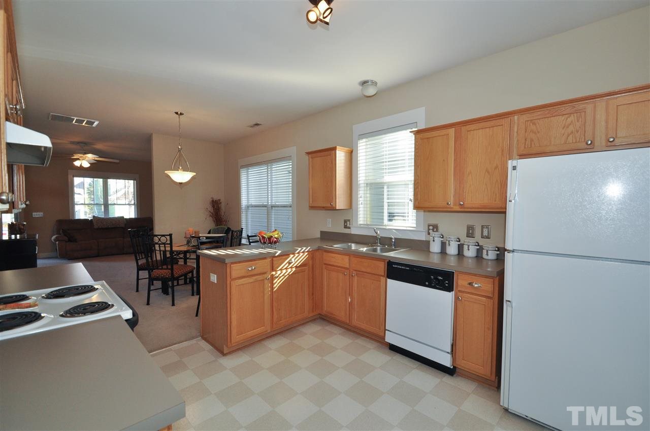 10748 Cokesbury Lane Raleigh, NC 27614 - Photo 8 of 16 a kitchen with lots of counter top space and appliances