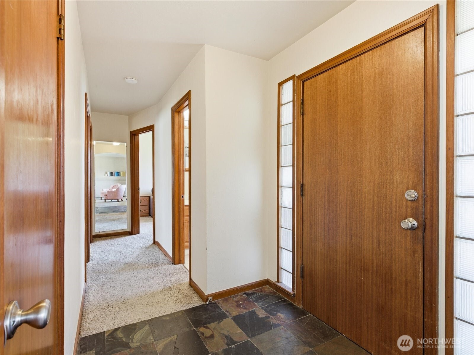 1417 Maple Street Sumner, WA 98390 - Photo 12 of 40 a view of a hallway with wooden shelves