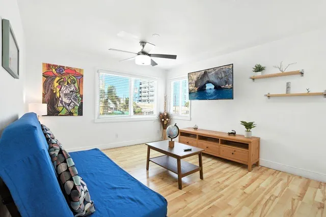 a living room with furniture and a window