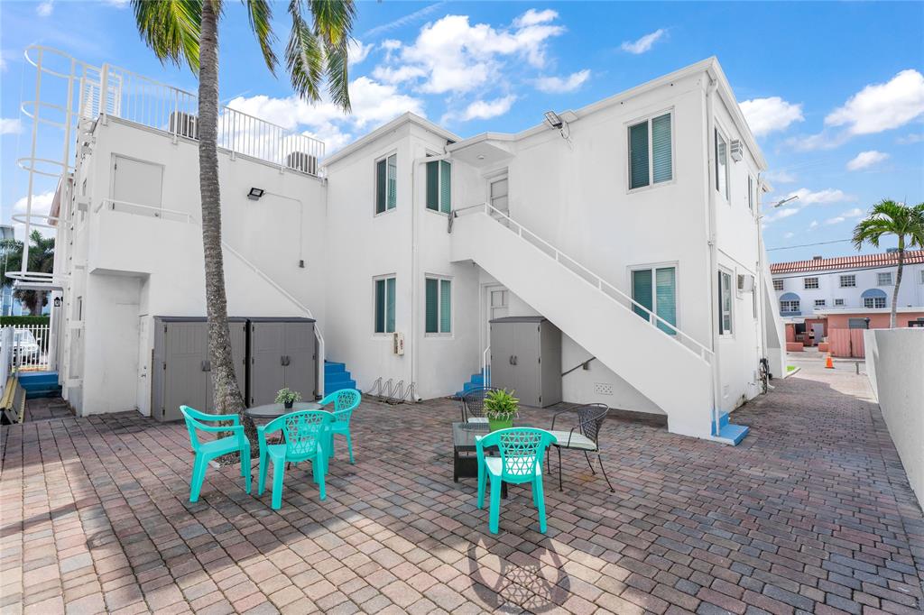 343 Van Buren Street, Unit 8 Hollywood, FL 33019 - Photo 8 of 8 a view of a house with backyard and sitting area