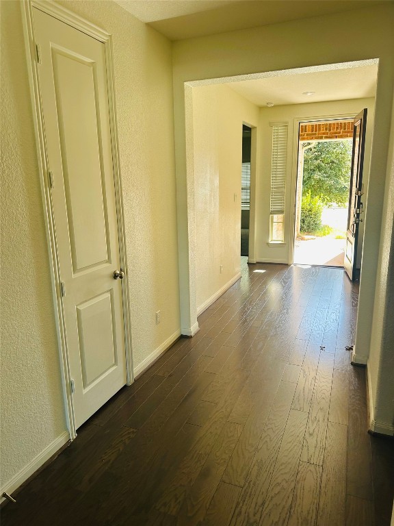 608 Sixpence Lane Georgetown, TX 78628 - Photo 17 of 27 a view of a hallway with wooden floor and a bathroom