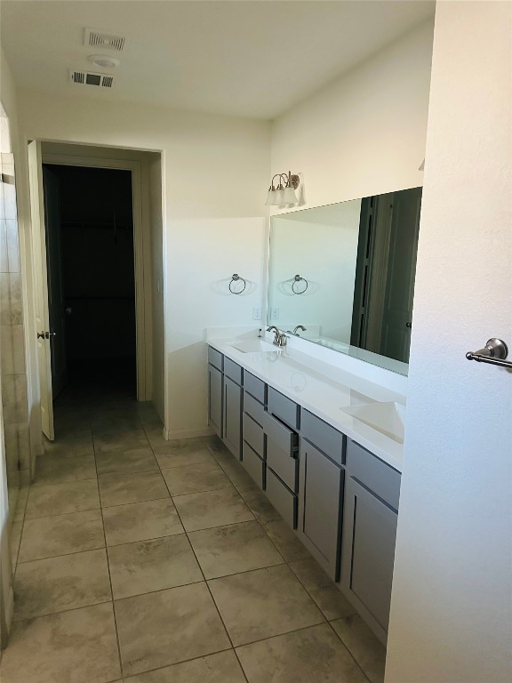 608 Sixpence Lane Georgetown, TX 78628 - Photo 18 of 27 a bathroom with a sink and a mirror