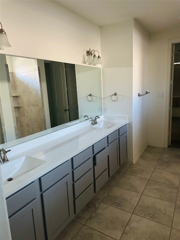 608 Sixpence Lane Georgetown, TX 78628 - Photo 19 of 27 a spacious bathroom with a double vanity sink a mirror and a shower