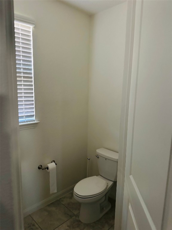 608 Sixpence Lane Georgetown, TX 78628 - Photo 23 of 27 a white toilet sitting next to a window