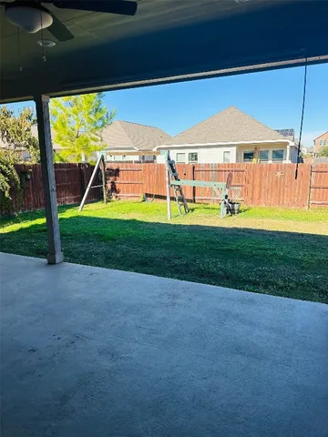 a house view with a backyard space