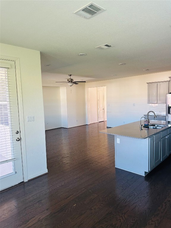 608 Sixpence Lane Georgetown, TX 78628 - Photo 10 of 27 an empty room with wooden floor and windows