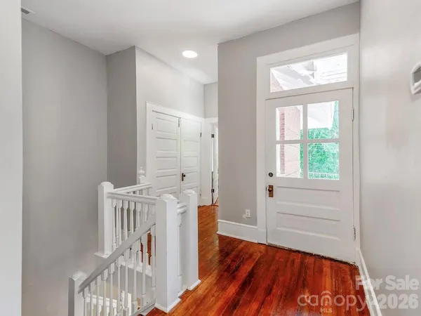 a view of front door with wooden floor
