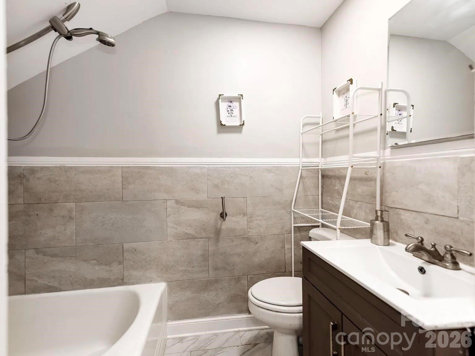 128 West End Street Chester, SC 29706 - Photo 23 of 40 a bathroom with a sink a toilet and shower