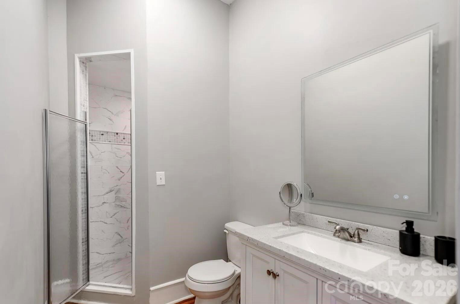 128 West End Street Chester, SC 29706 - Photo 27 of 40 a bathroom with a sink a toilet and shower