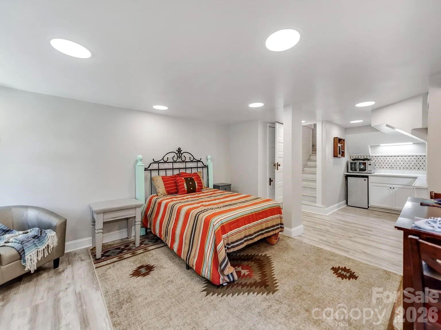 128 West End Street Chester, SC 29706 - Photo 30 of 40 a spacious bedroom with a bed and a couch