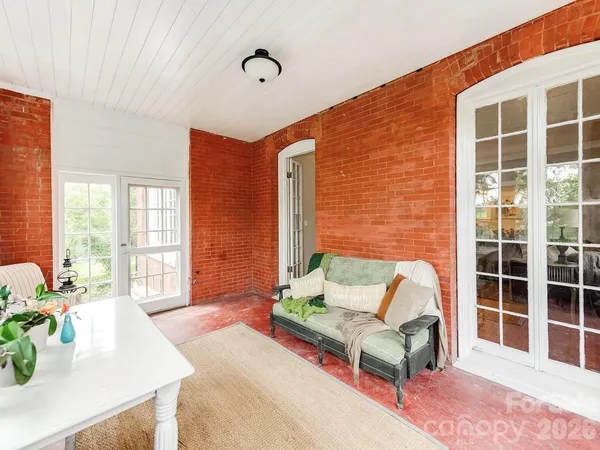 a living room with furniture and windows