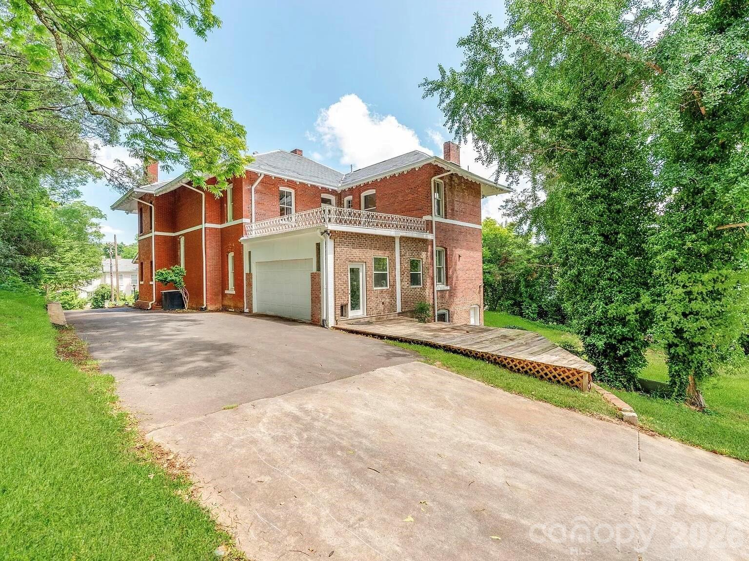 128 West End Street Chester, SC 29706 - Photo 39 of 40 a front view of a house with a yard and garage