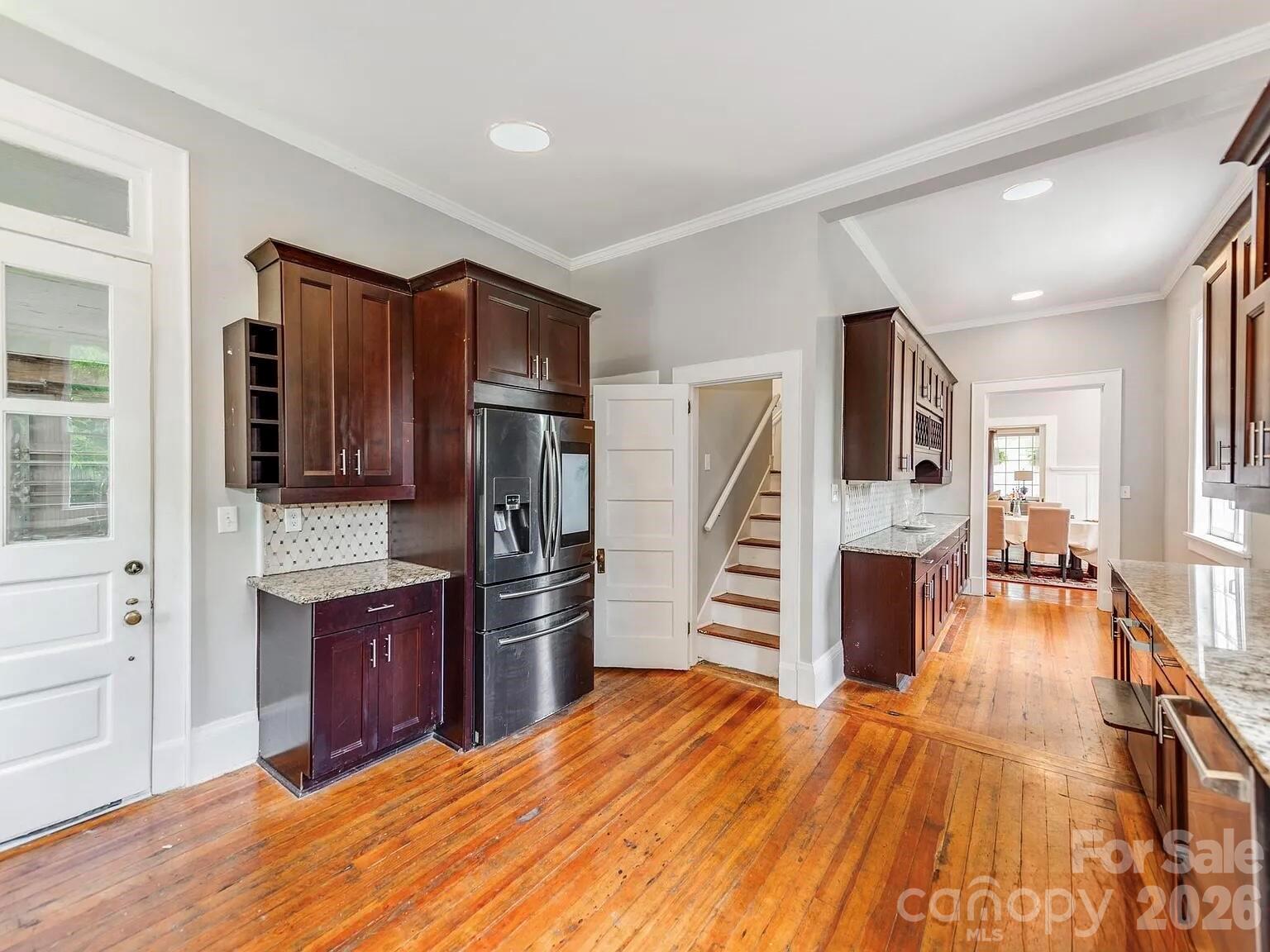 128 West End Street Chester, SC 29706 - Photo 8 of 40 a kitchen with stainless steel appliances kitchen island granite countertop a refrigerator and a stove top oven
