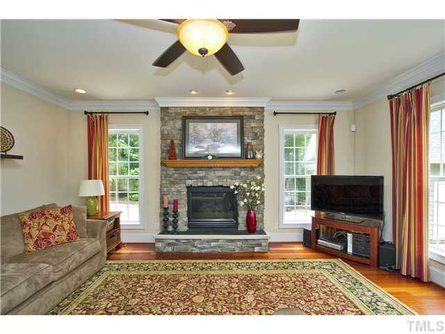 6816 Pinnacle Ridge Road Raleigh, NC 27603 - Photo 11 of 24 Another look at the family room with fireplace. Den/Family/Great Room