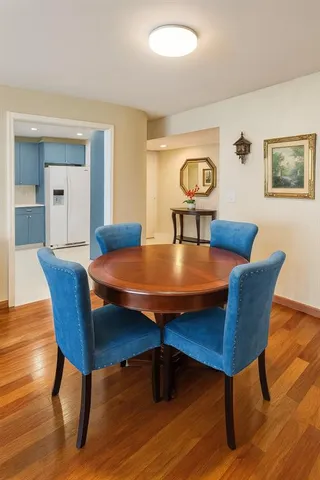 a view of a dining room with furniture and wooden floor