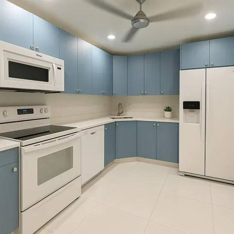 a kitchen with granite countertop a stove top oven a sink dishwasher a dining table and chairs with wooden floor