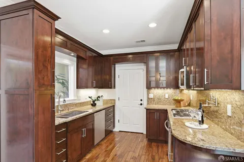 a bathroom with a sink double vanity granite and a mirror