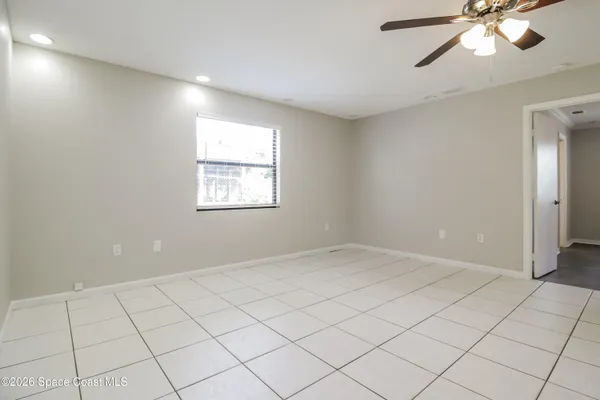 a view of an empty room and window