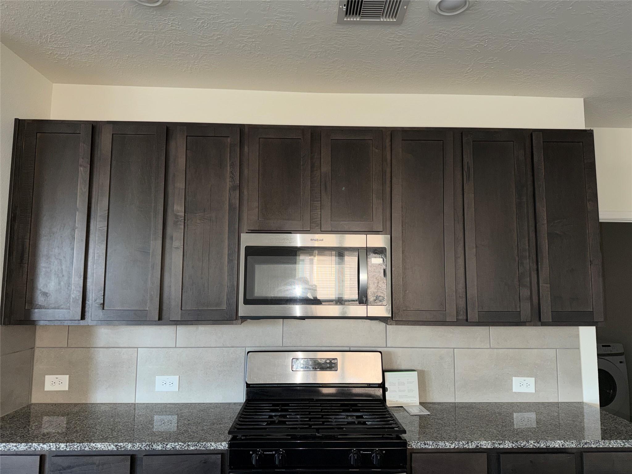 14622 Cypress Creek Landing Houston, TX 77068 - Photo 11 of 33 a kitchen with a cabinets and a stove top oven
