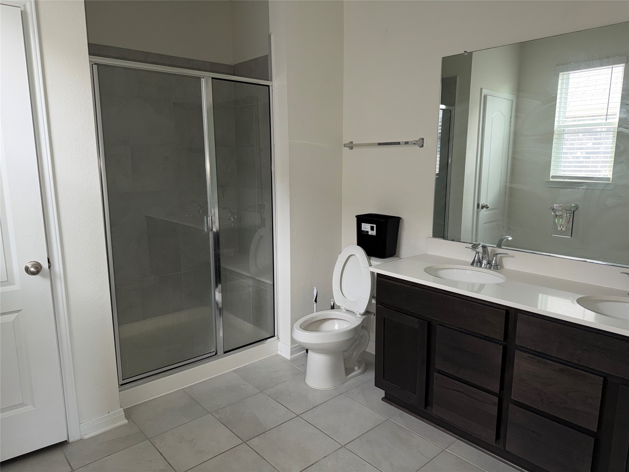 14622 Cypress Creek Landing Houston, TX 77068 - Photo 17 of 33 a bathroom with a double vanity sink toilet and shower