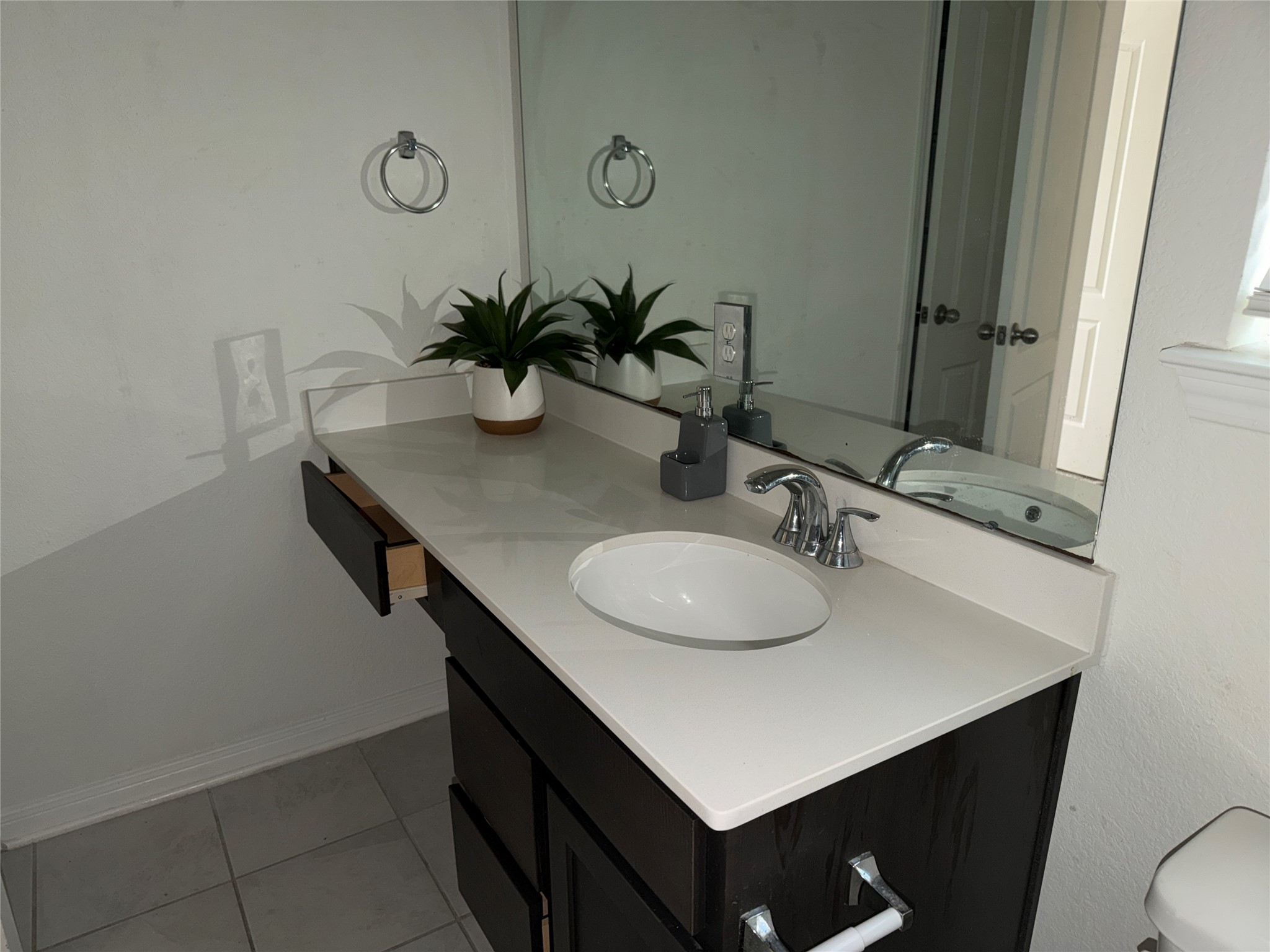 14622 Cypress Creek Landing Houston, TX 77068 - Photo 27 of 33 a bathroom with a sink vanity and a mirror