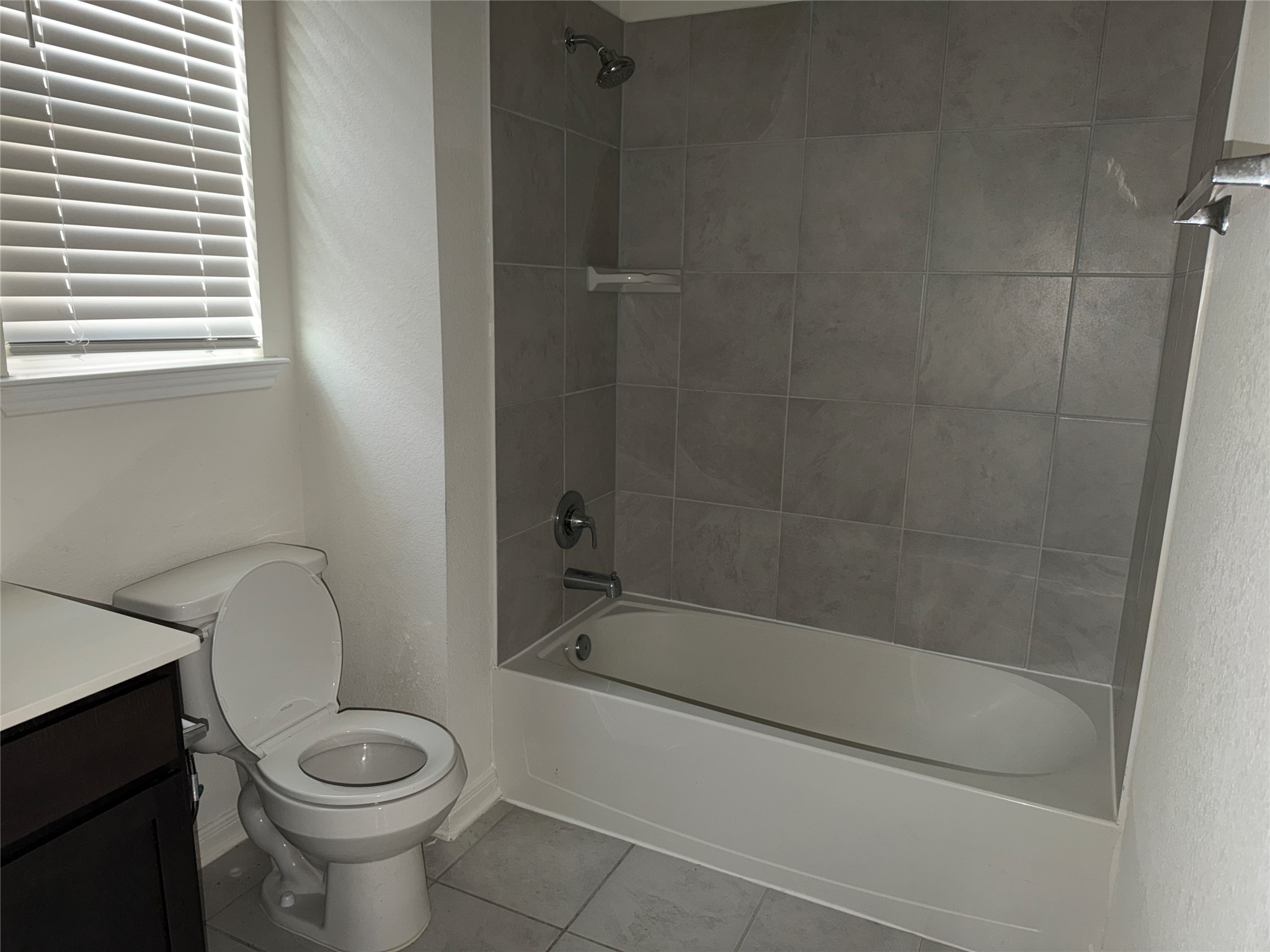 14622 Cypress Creek Landing Houston, TX 77068 - Photo 30 of 33 a bath room with a toilet and a bath tub